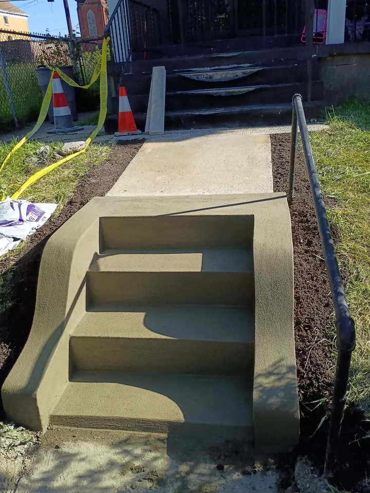 Restored concrete entrance steps and landing
