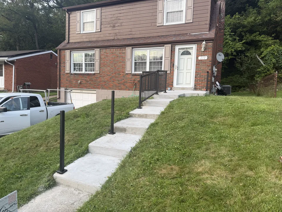 Completed metal railing along residential entrance steps