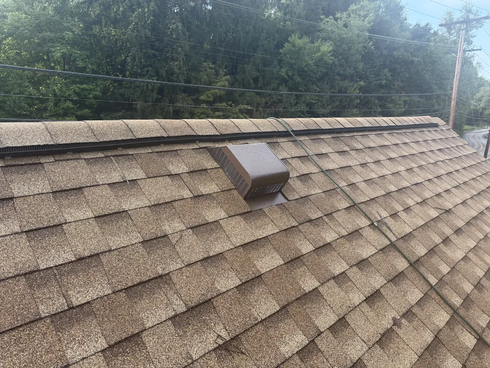 Finished shingles and roof vent
