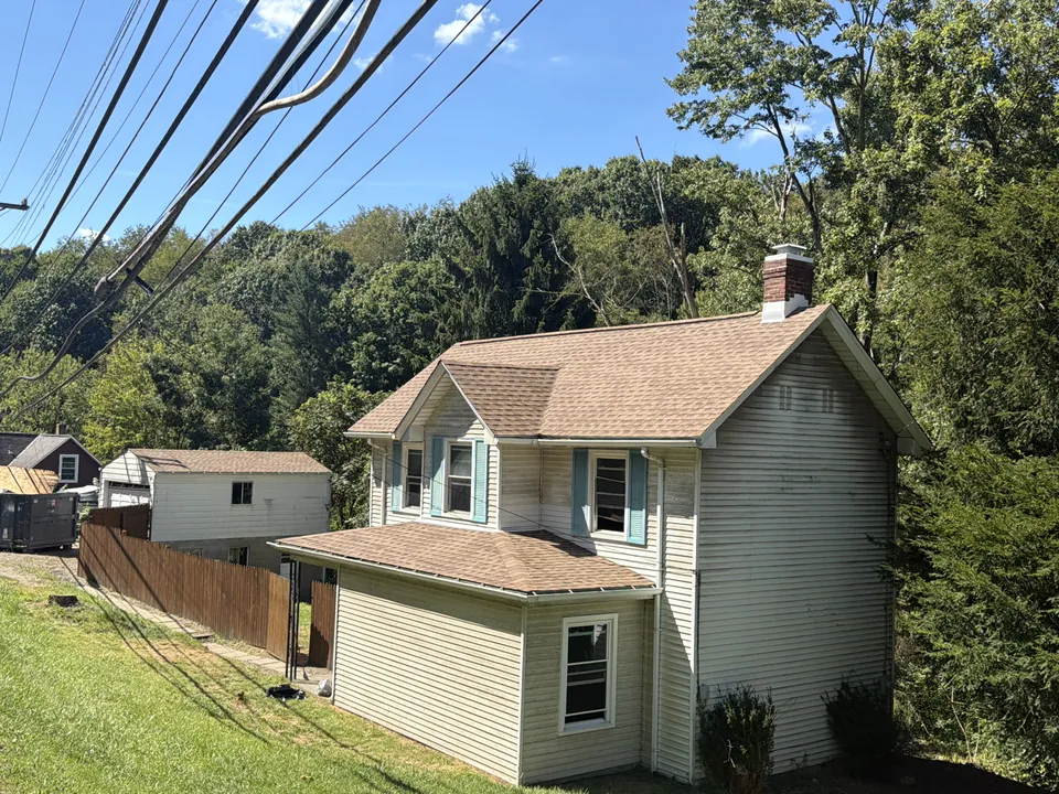 House with completed shingle roof